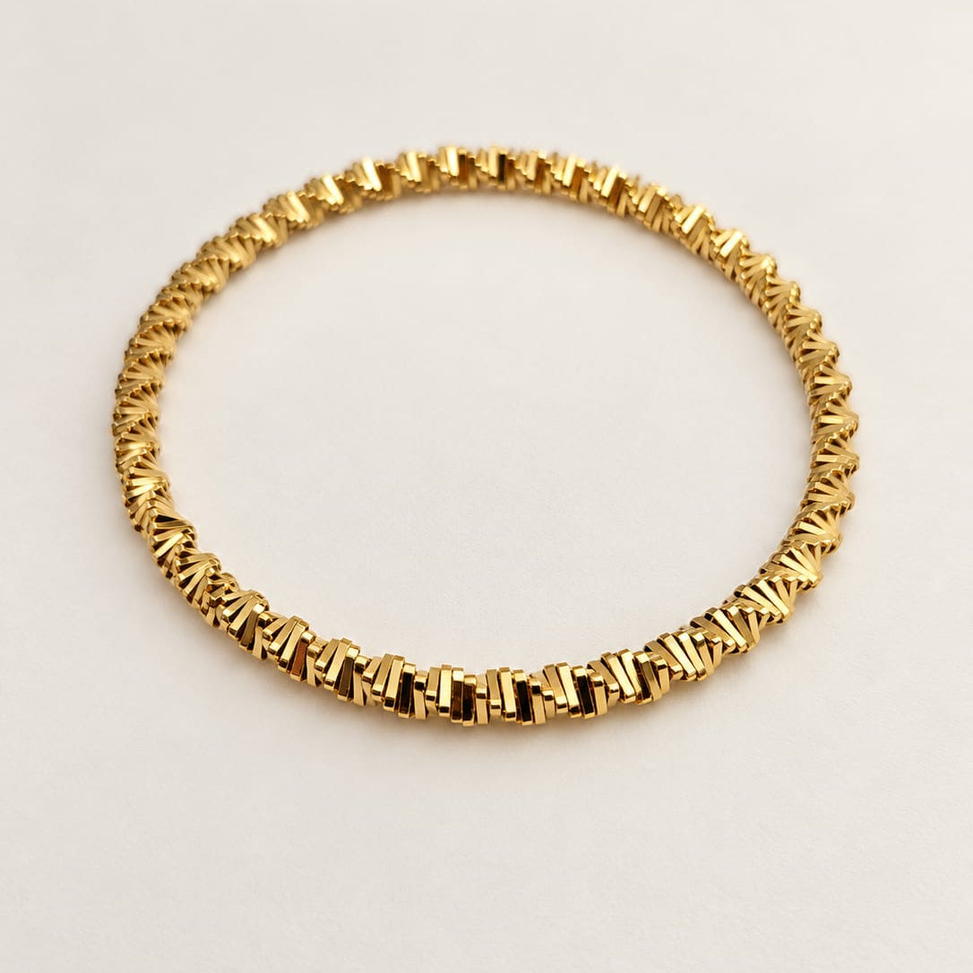NAYA – Bracelet maillons dorés tressés