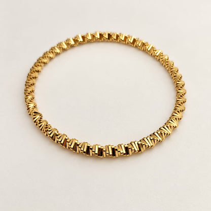 NAYA – Bracelet maillons dorés tressés