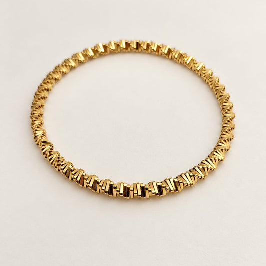 NAYA – Bracelet maillons dorés tressés