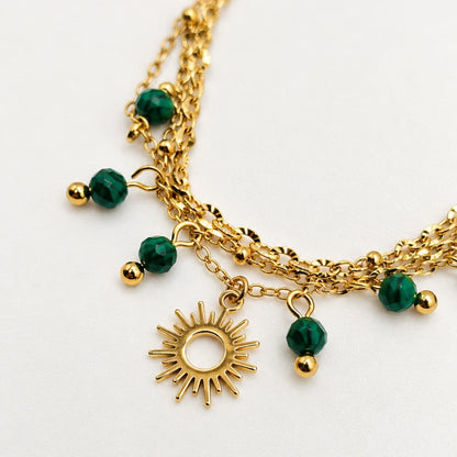 NOMI – Bracelet doré soleil & perles vertes